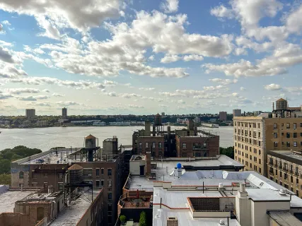 a view of a terrace with lawn chairs