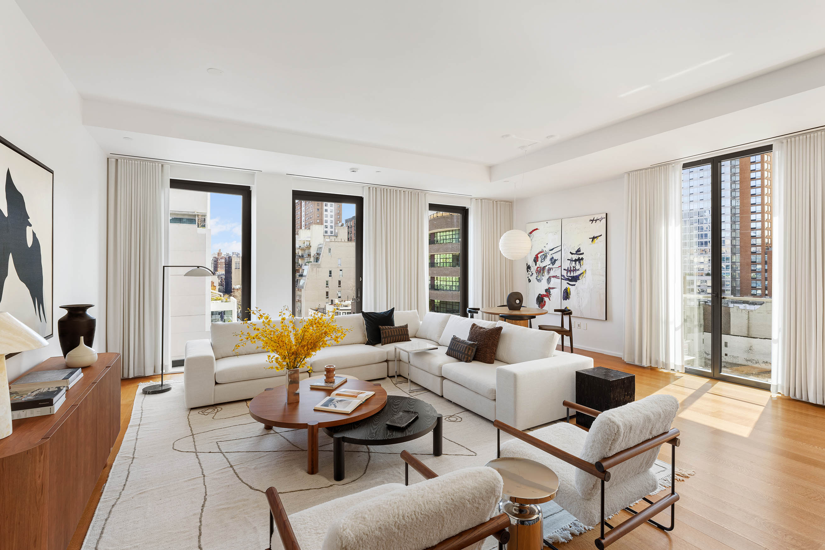 505 West 19th Street, Unit PH1 Manhattan, NY 10011 - Photo 10 of 26 a living room with furniture and wooden floor