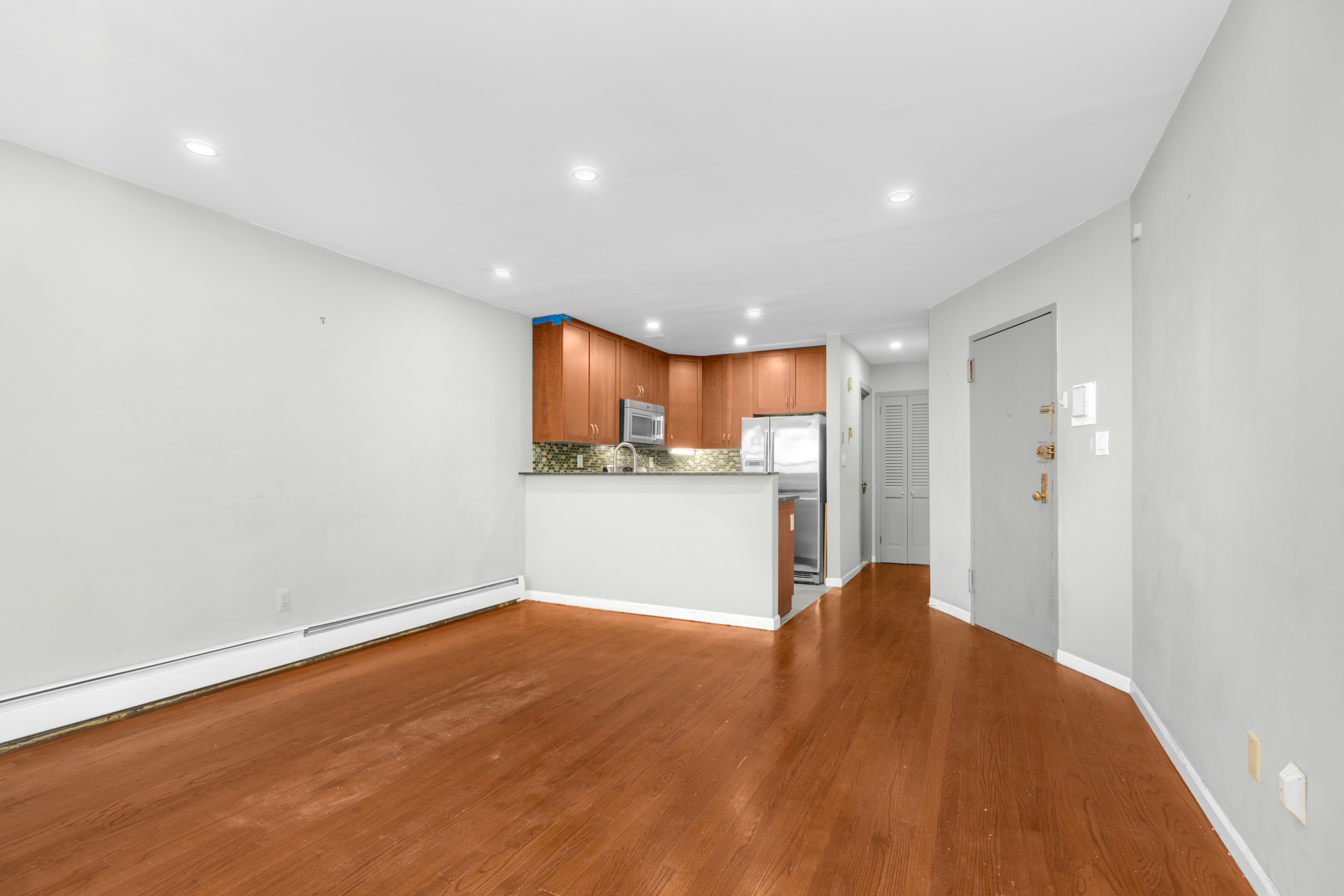 252 West 102nd Street, Unit 1 Manhattan, NY 10025 - Photo 2 of 12 a view of kitchen with wooden floor