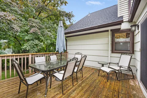 a view of a chairs and table on the balcony