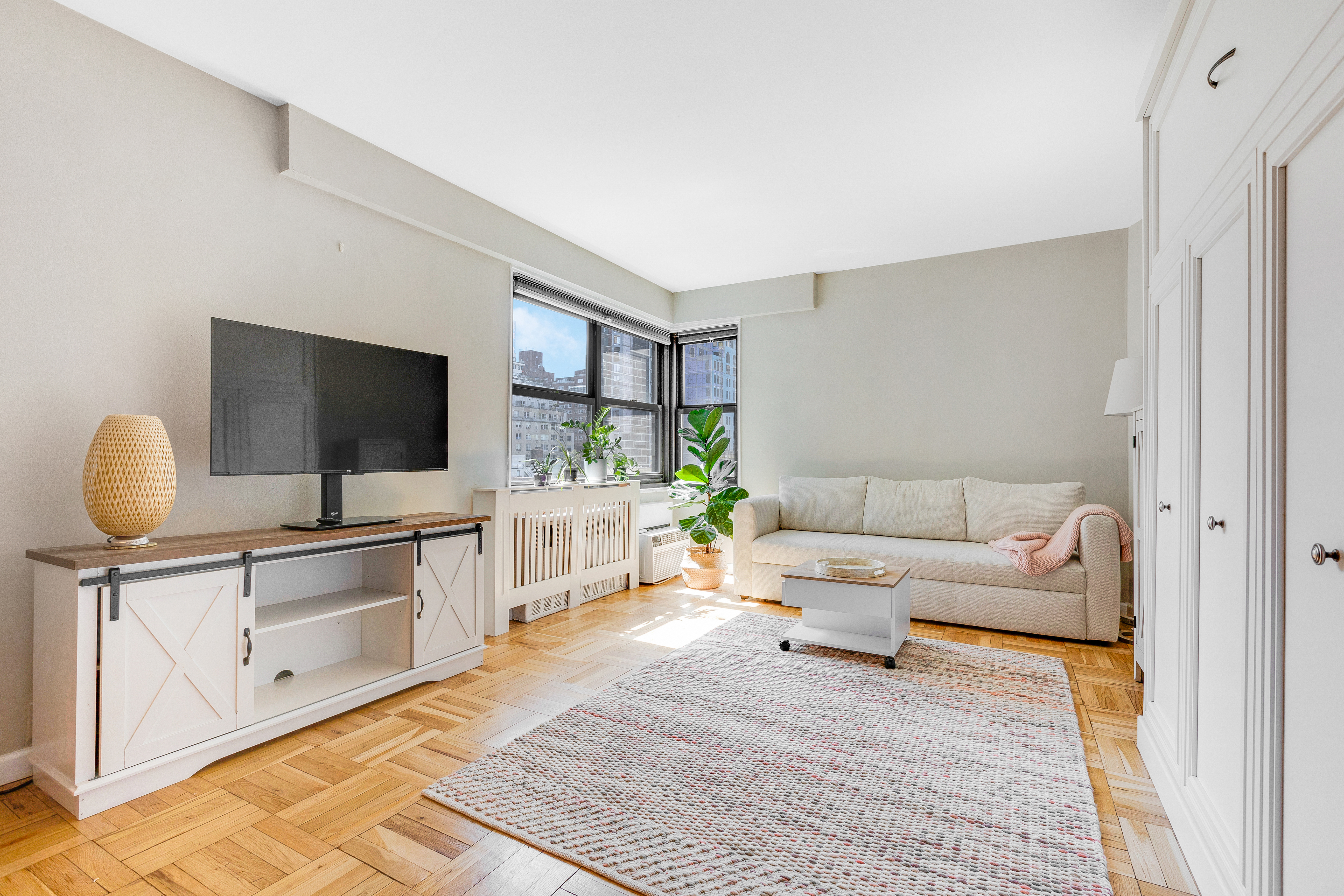 a living room with furniture and a flat screen tv