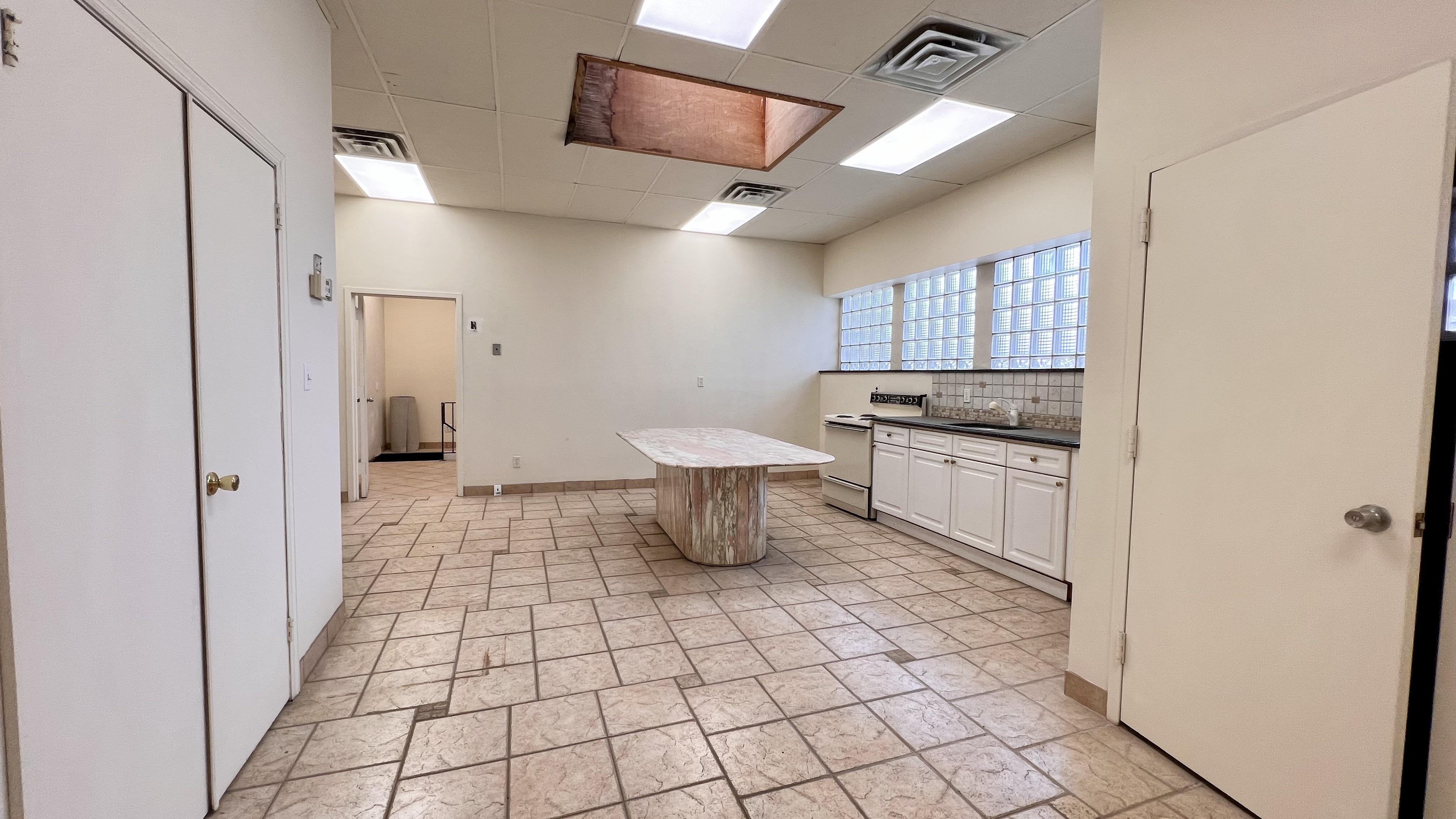 3 Elm Street, Unit 2 Locust Valley, NY 11560 - Photo 3 of 5 a bathroom with a sink a toilet and mirror