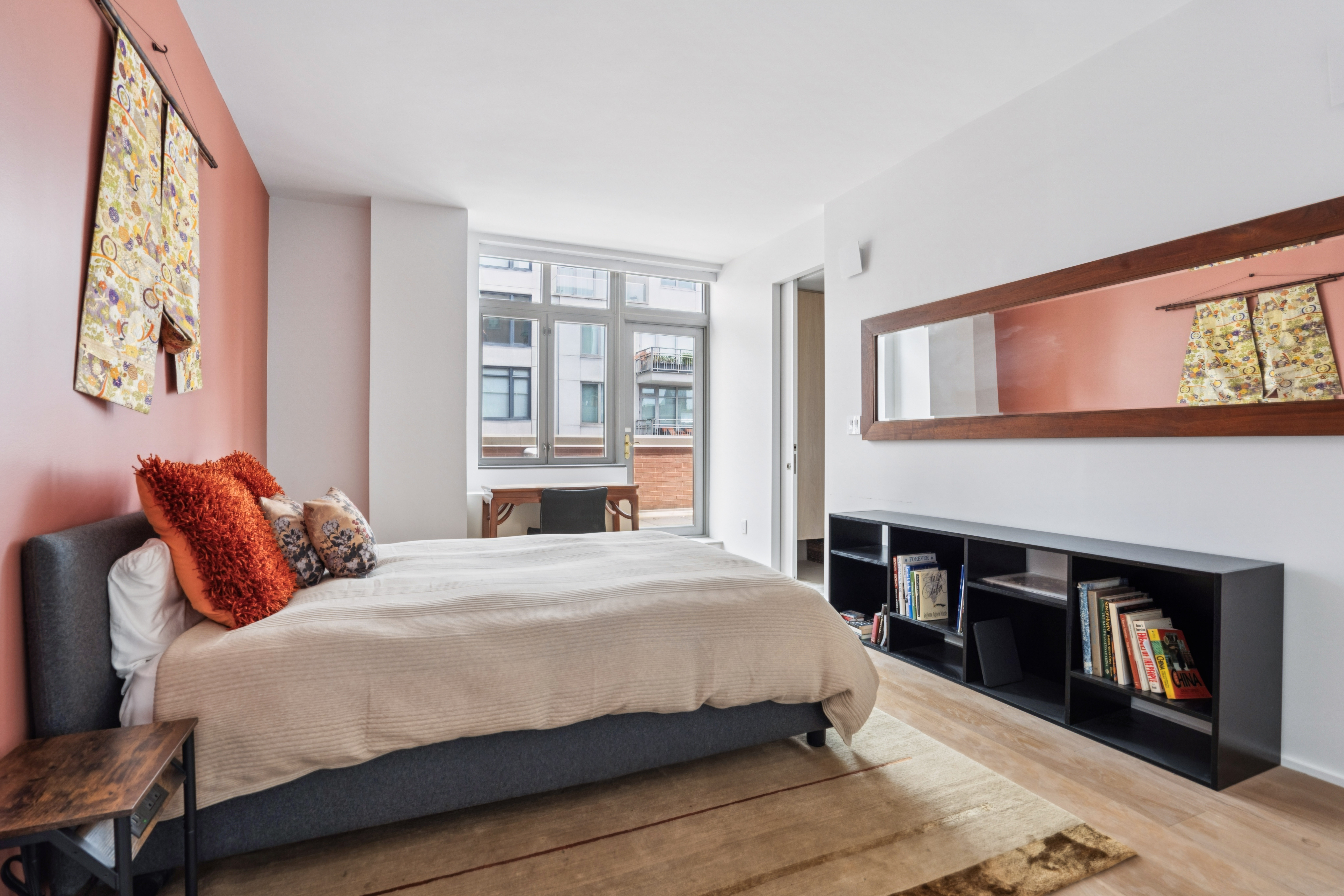 125 West 22nd Street, Unit 10A Manhattan, NY 10011 - Photo 8 of 12 a bedroom with a bed and a large window