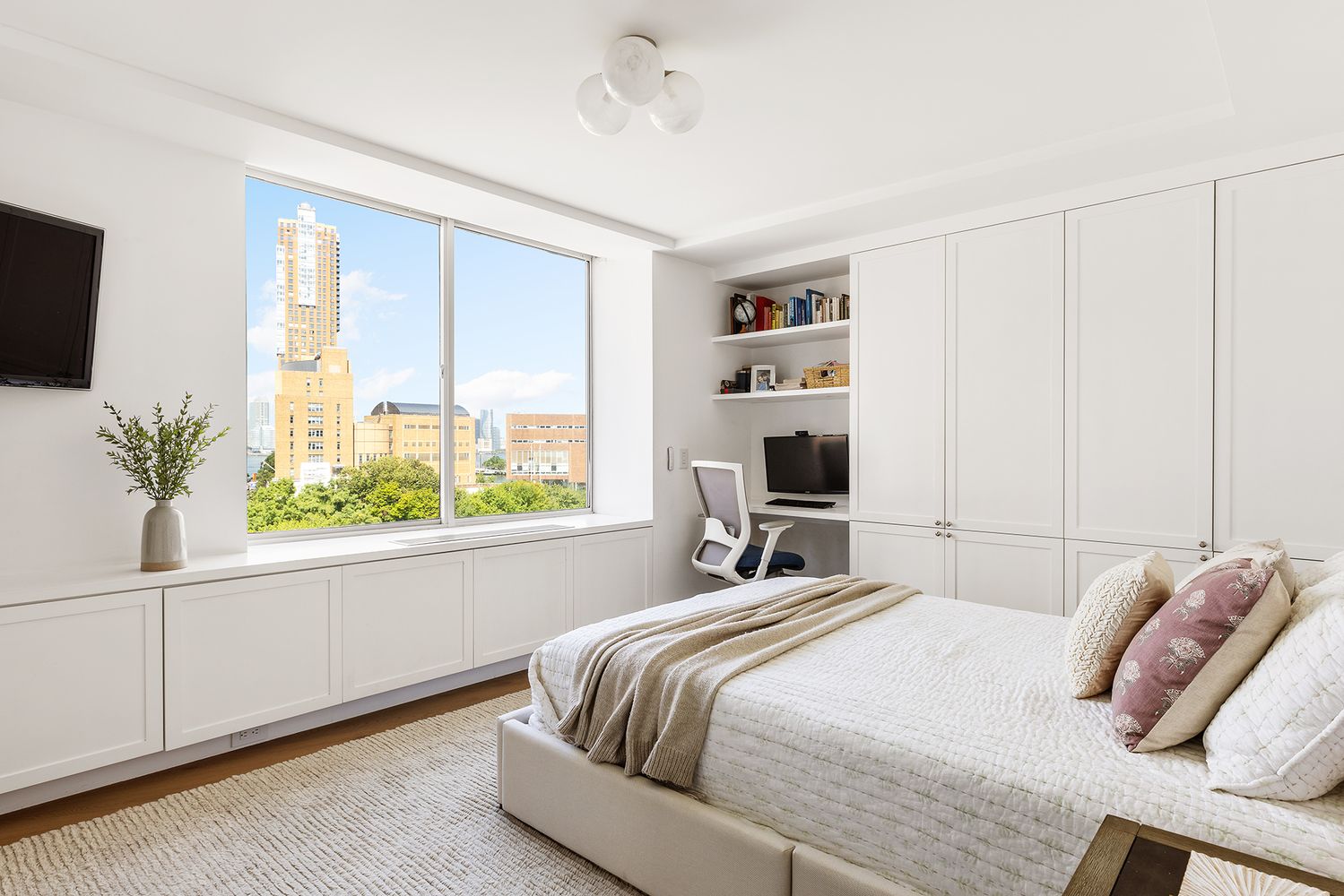 303 Greenwich Street, Unit 8DE Manhattan, NY 10013 - Photo 9 of 20 a bedroom with a bed and a window