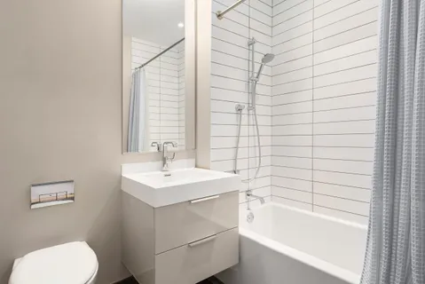 a bathroom with a sink toilet and bathtub