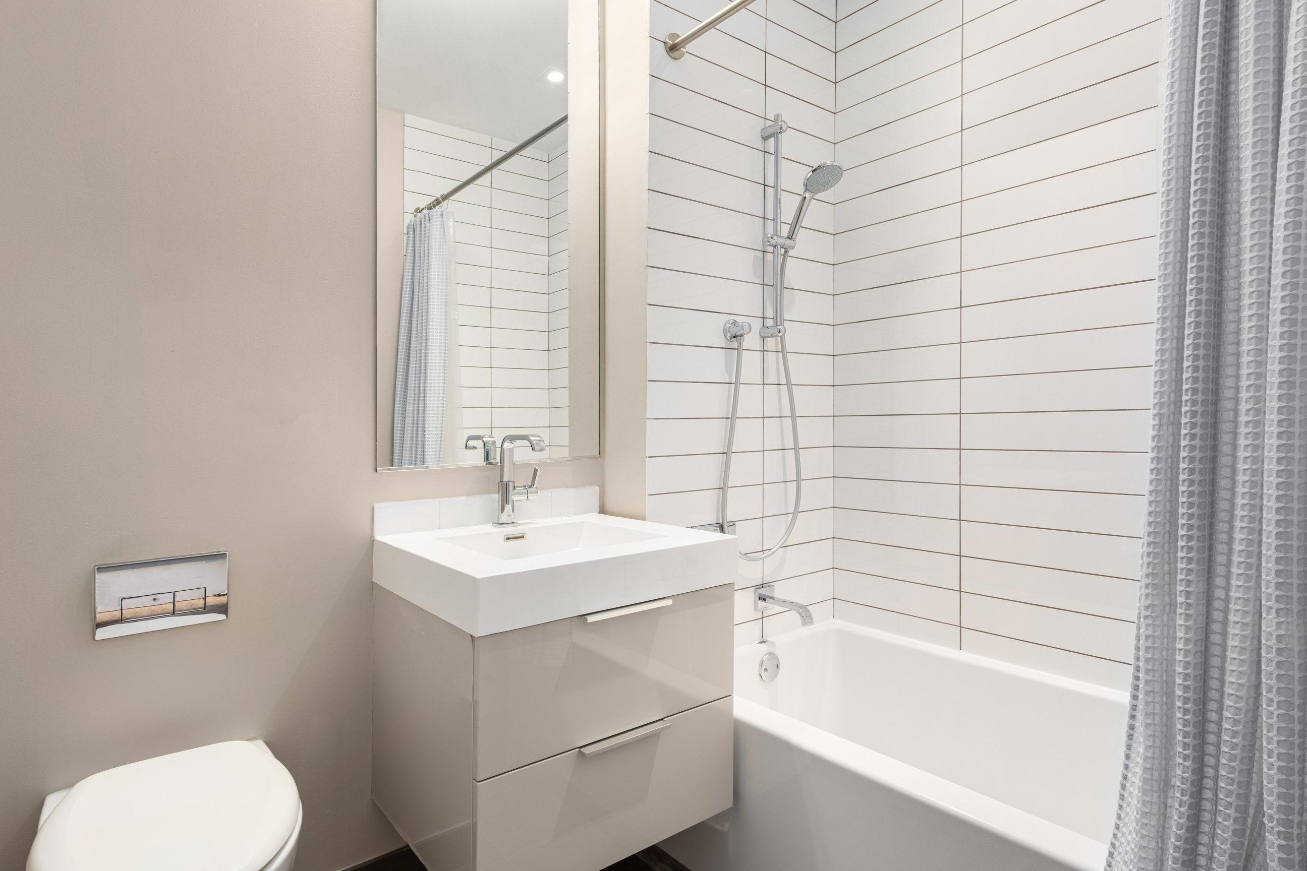 101 Leonard Street, Unit 2E Manhattan, NY 10013 - Photo 15 of 16 a bathroom with a sink toilet and bathtub
