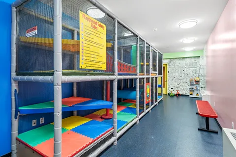 a view of a terrace with furniture and flowers