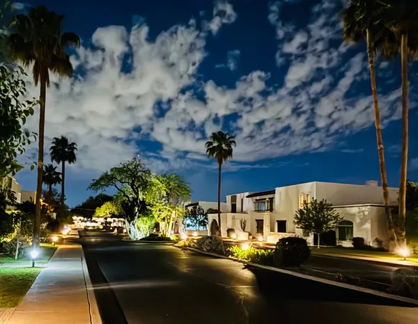 a view of a city street from a patio