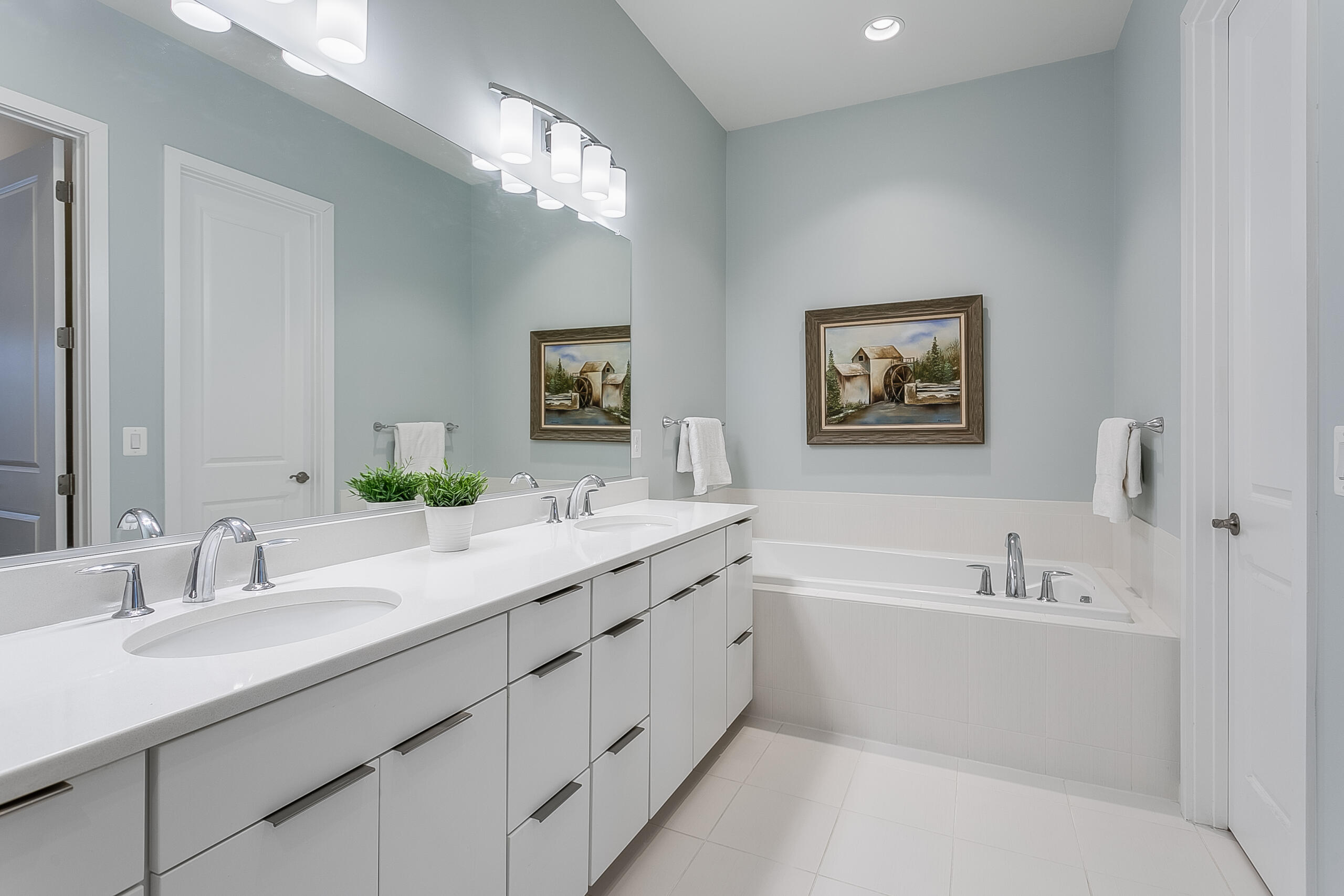 1011 Justinian Street Leesburg, VA 20175 - Photo 30 of 56 a bathroom with a double vanity sink and a mirror