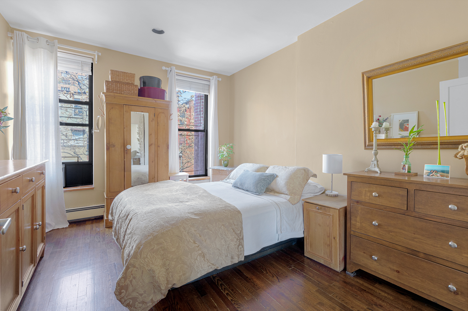 161 West 71st Street, Unit 4 Manhattan, NY 10023 - Photo 6 of 15 a bedroom with a bed and a dresser