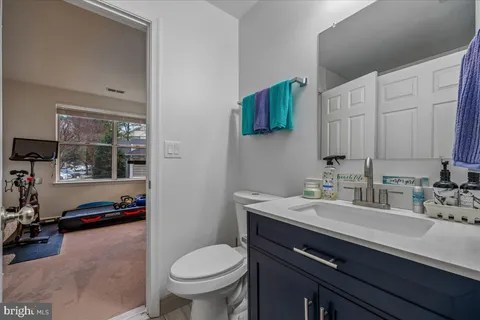 a bathroom with a sink double vanity and a toilet