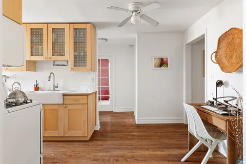 a kitchen with stainless steel appliances granite countertop a sink and cabinets
