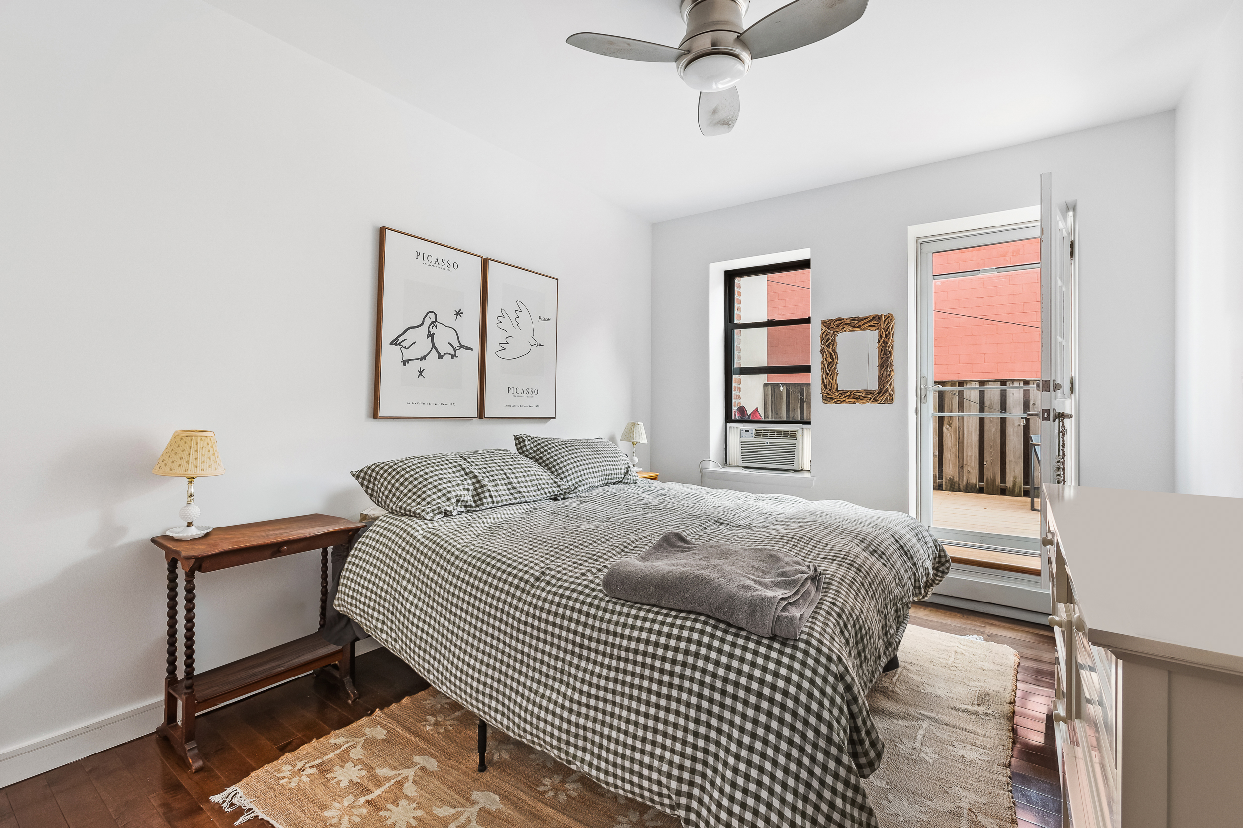 185 Smith Street Brooklyn, NY 11201 - Photo 11 of 14 a bedroom with a bed and a window