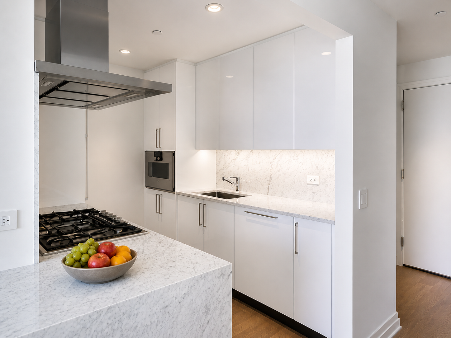 460 West 42nd Street, Unit 51H Manhattan, NY 10036 - Photo 3 of 14 a kitchen with stainless steel appliances granite countertop a sink stove and refrigerator