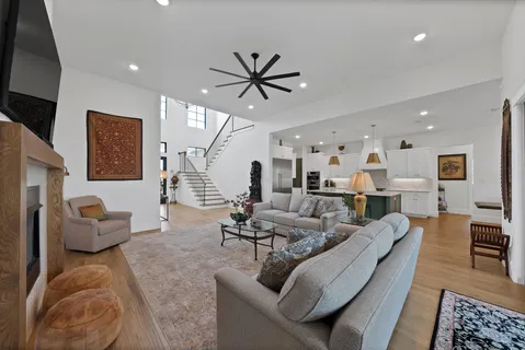 a living room with furniture and wooden floor