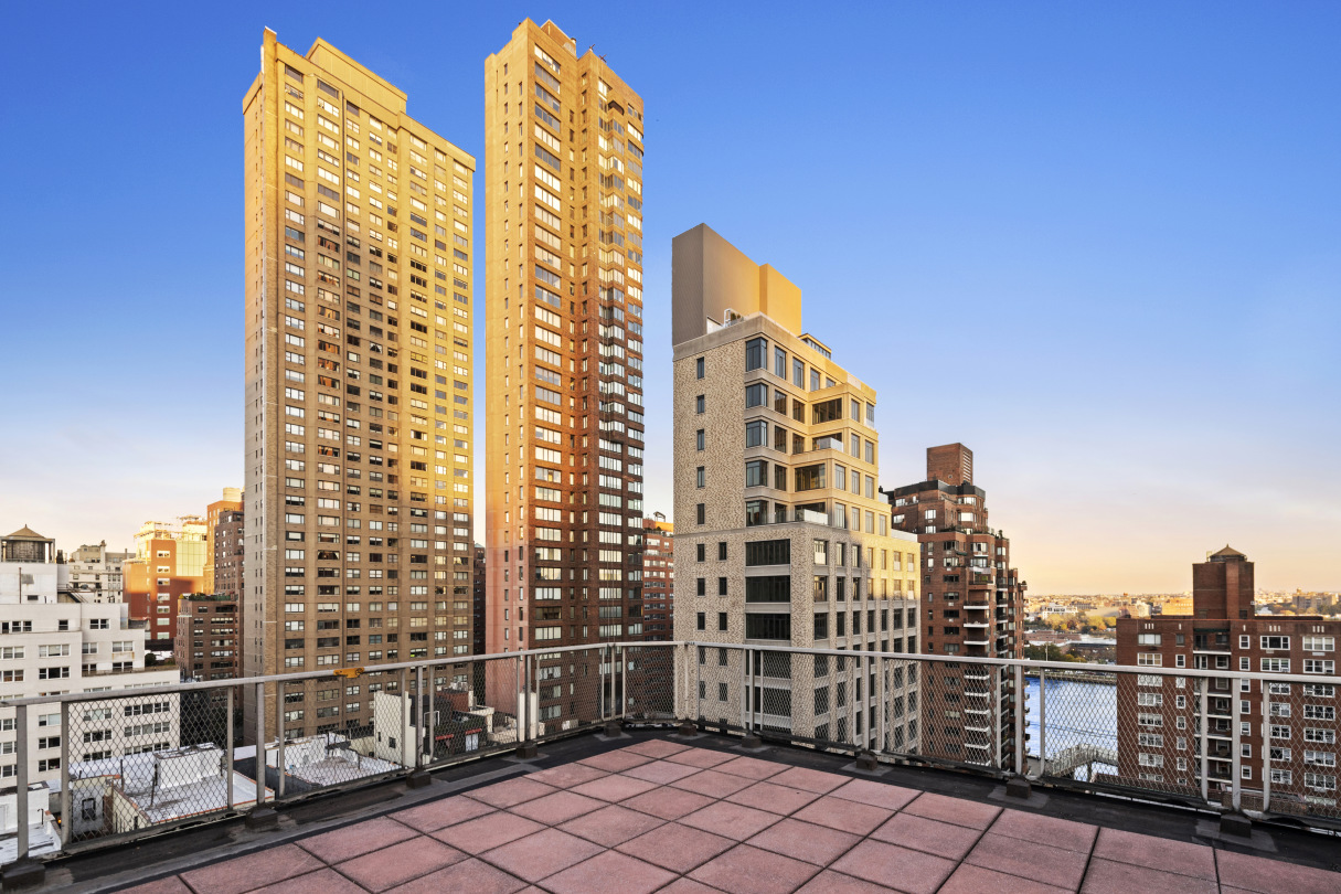 520 East 81st Street, Unit 14C Manhattan, NY 10028 - Photo 11 of 13 a view of a tall building