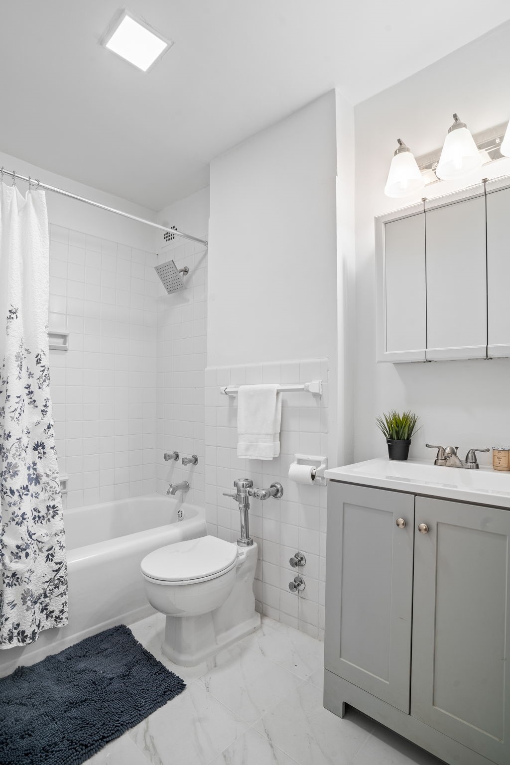 150 East 61st Street, Unit 8B Manhattan, NY 10065 - Photo 21 of 30 a bathroom with a sink a toilet and shower