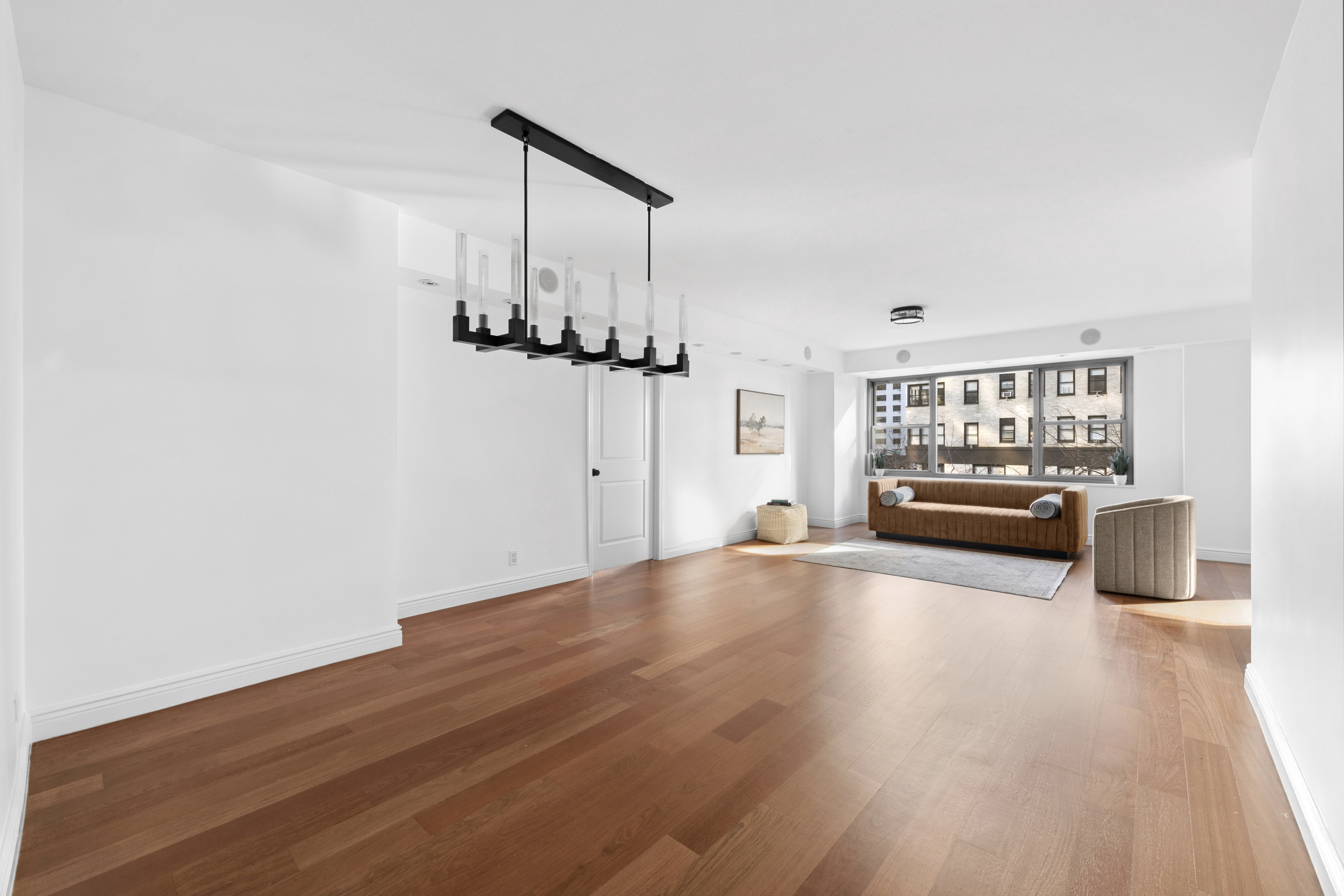 400 East 56th Street, Unit 3D Manhattan, NY 10022 - Photo 2 of 24 a view of a livingroom with furniture and a wooden floor