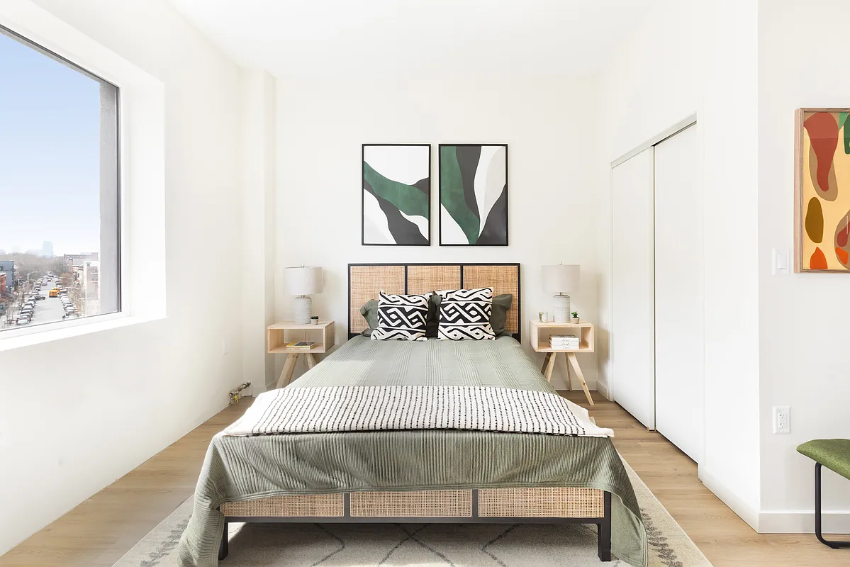8 Palmetto Street, Unit 713 Brooklyn, NY 11221 - Photo 4 of 23 a bedroom with a bed and a window
