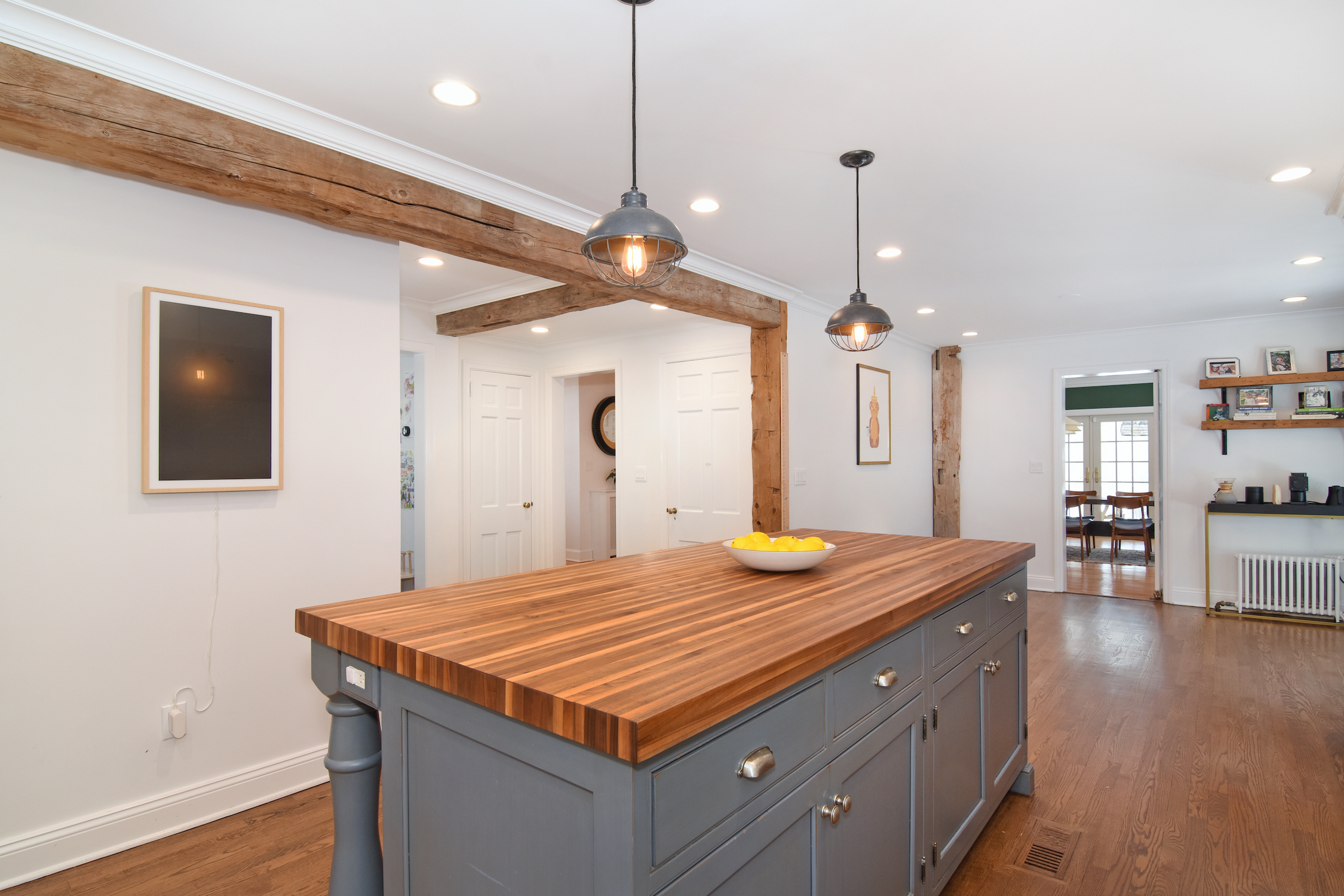41 Harris Road Katonah, NY 10536 - Photo 5 of 48 a kitchen island with a granite countertop sink and a refrigerator