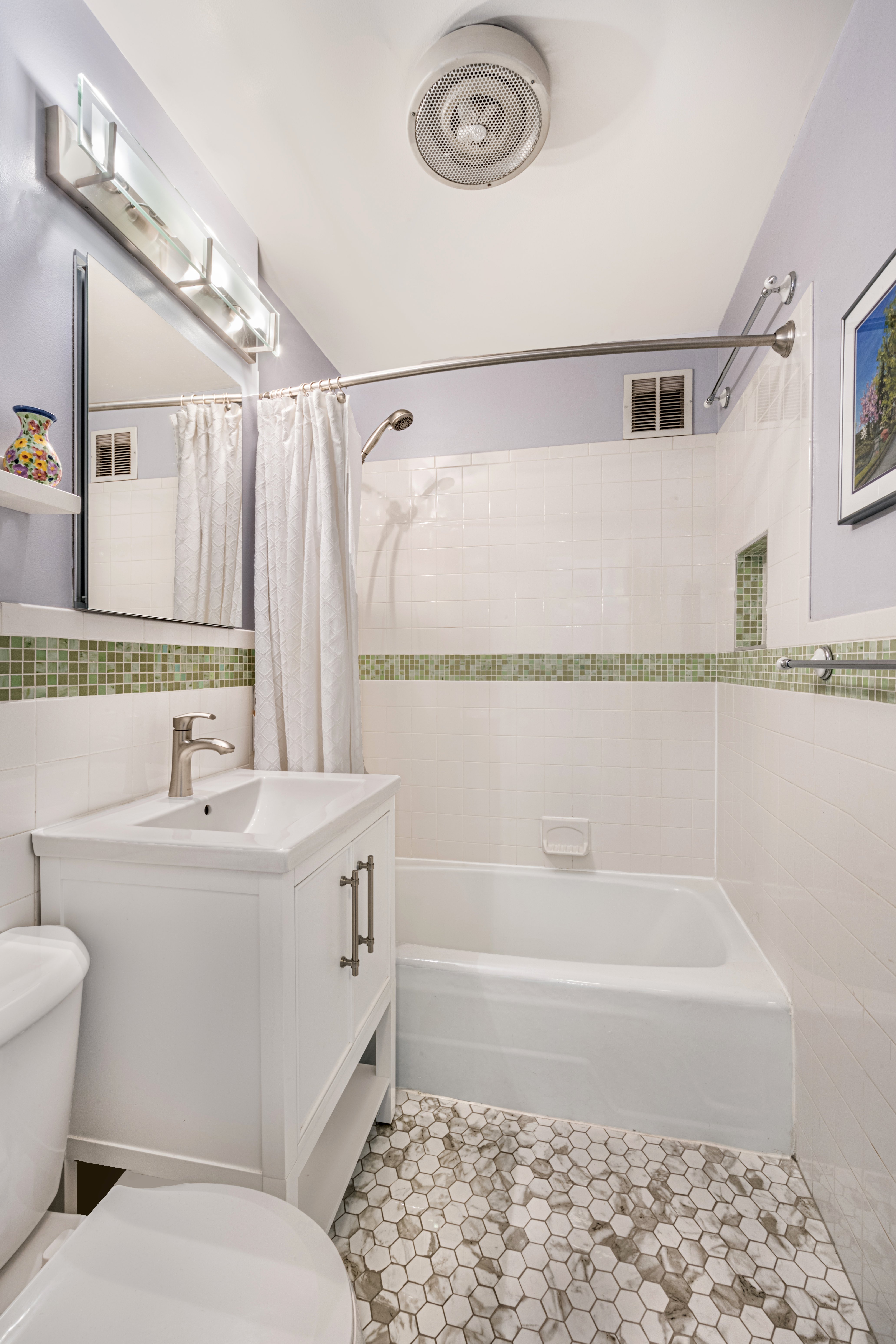 45 Overlook Terrace, Unit 4E Manhattan, NY 10033 - Photo 5 of 17 a bathroom with a sink a toilet and shower