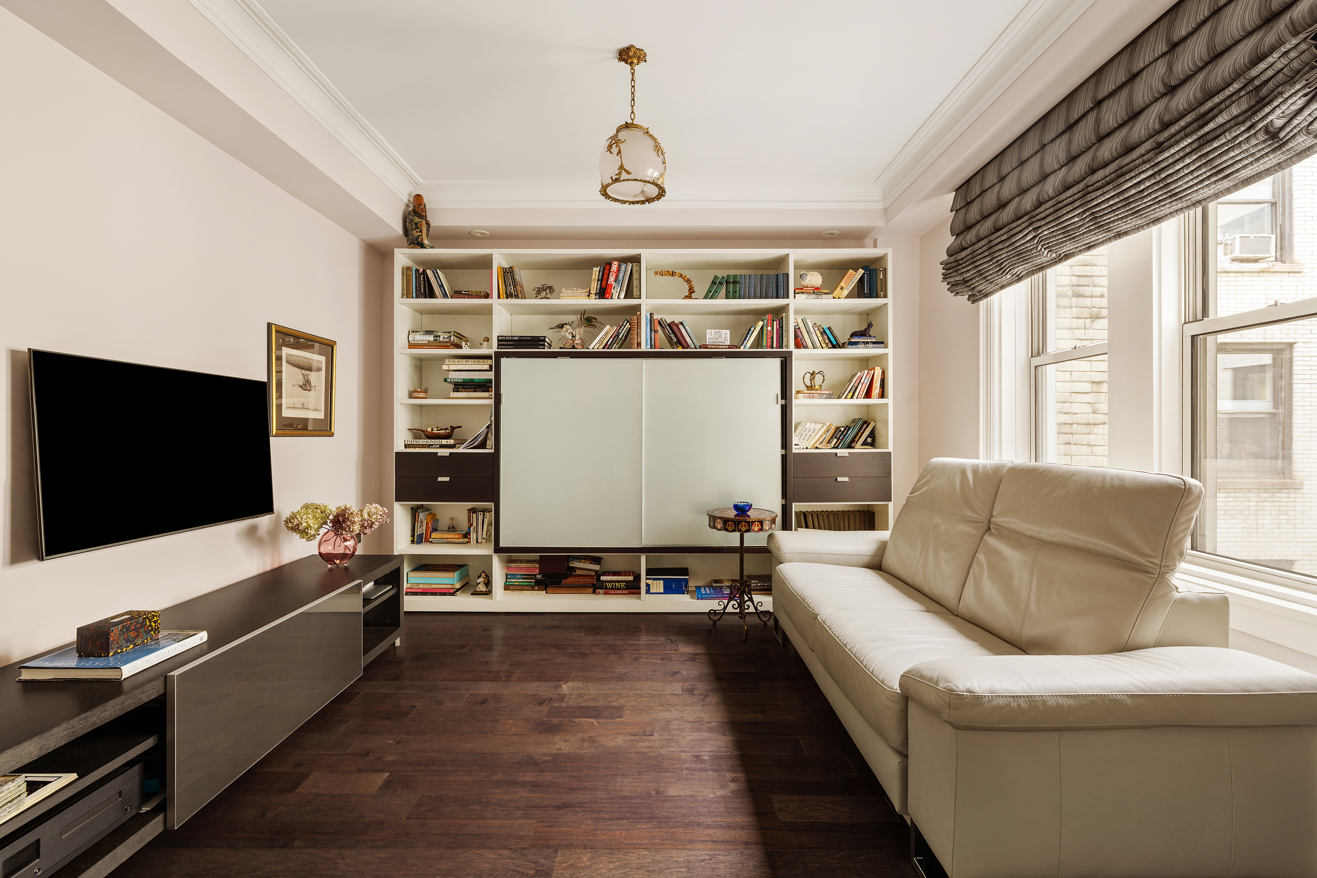 251 West 98th Street, Unit 7B Manhattan, NY 10025 - Photo 5 of 14 a living room with furniture and a flat screen tv
