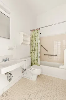 a bathroom with a bathtub and a sink