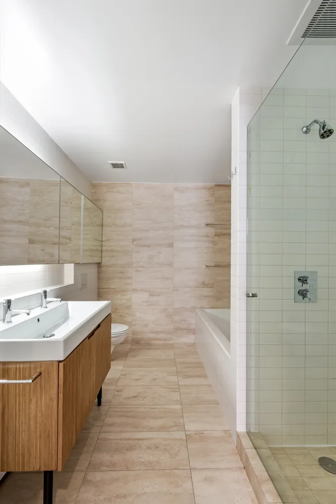 a spacious bathroom with a bathtub and a sink