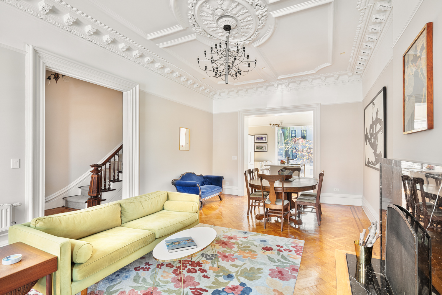380 3rd Street, Unit PARLOR Brooklyn, NY 11215 - Photo 2 of 19 a living room with furniture a chandelier and a dining table with wooden floor