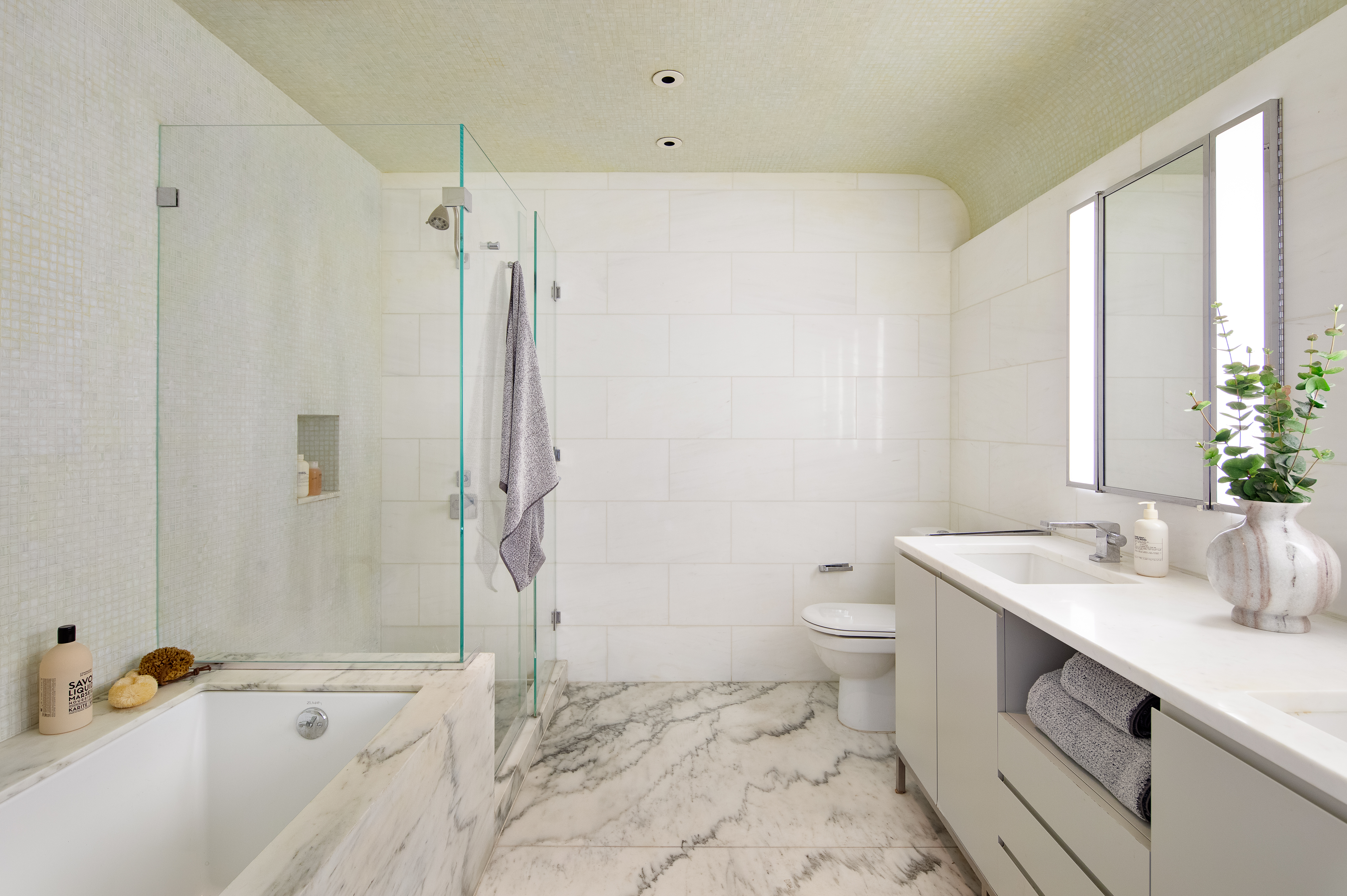 255 Hudson Street, Unit PHB Manhattan, NY 10013 - Photo 6 of 10 a bathroom with a sink toilet and shower