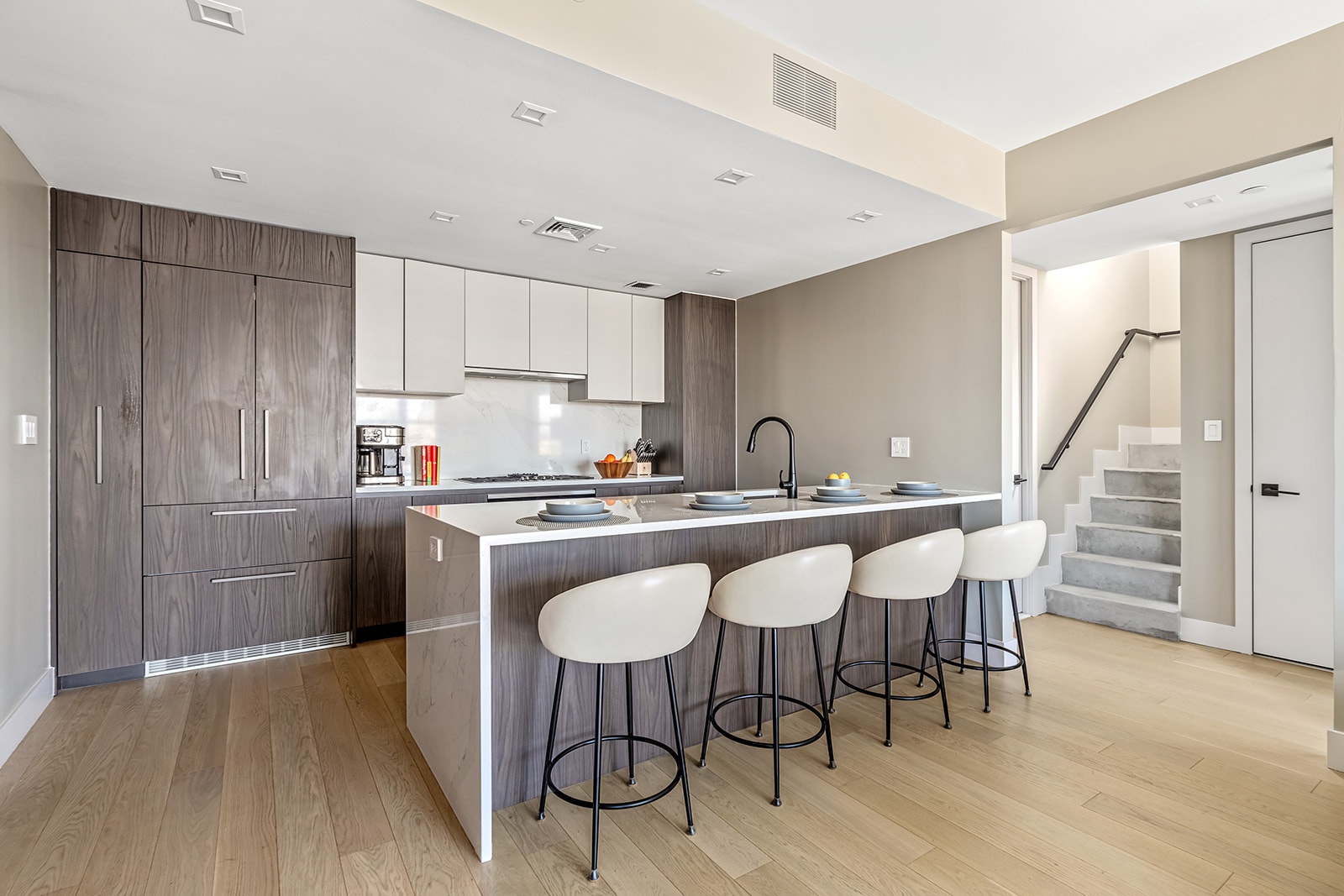 11 Hancock Place, Unit PH201 Manhattan, NY 10027 - Photo 2 of 10 a kitchen with granite countertop white cabinets and stainless steel appliances