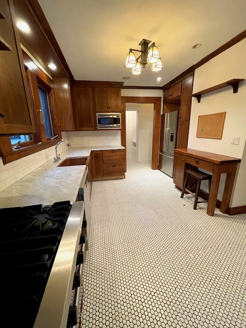 340 Marlborough Road Brooklyn, NY 11226 - Photo 12 of 27 a large bathroom with a sink and a mirror