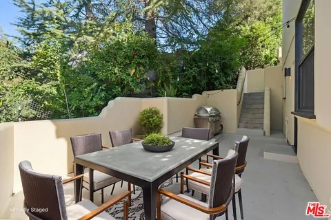 a large kitchen with stainless steel appliances lots of counter top space