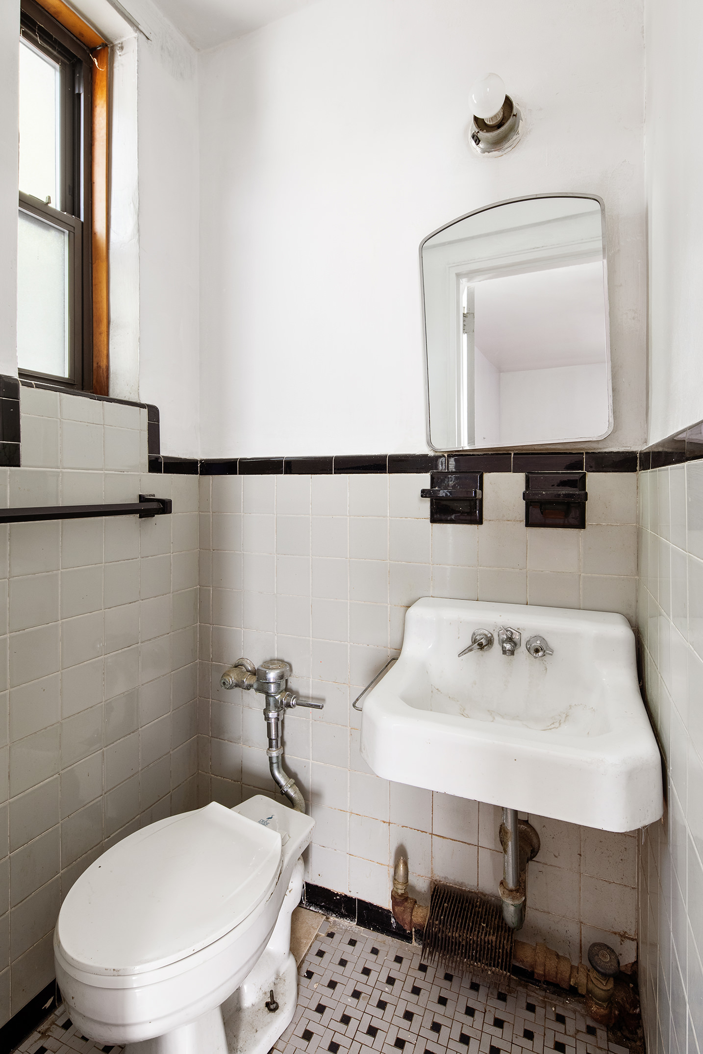 345 Webster Avenue, Unit 1U Brooklyn, NY 11230 - Photo 9 of 10 a bathroom with a sink a toilet and mirror