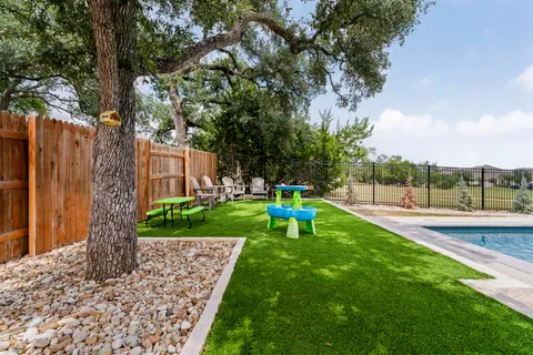 an aerial view of residential houses with outdoor space