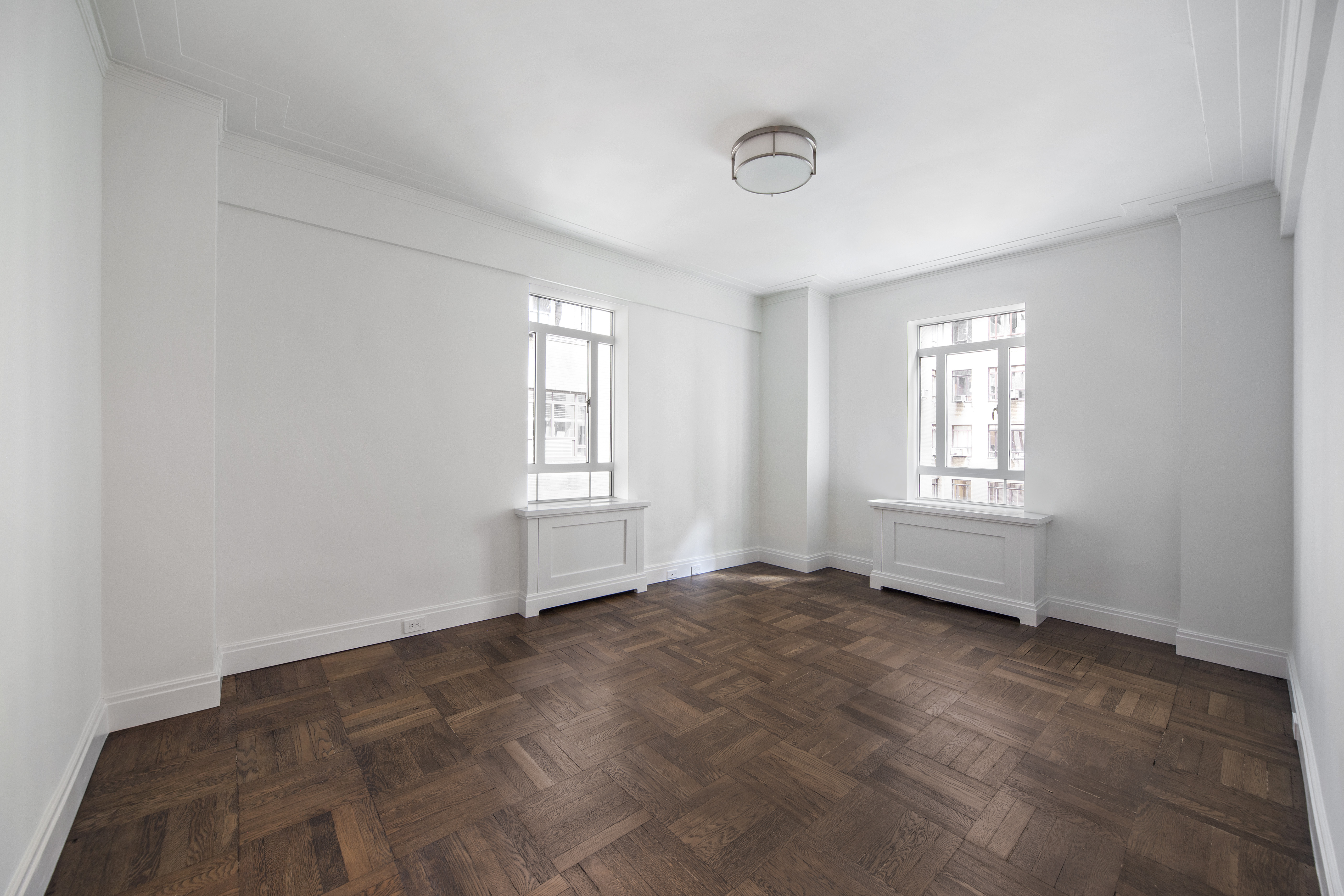 25 Central Park West, Unit 4U Manhattan, NY 10023 - Photo 6 of 8 an empty room with windows