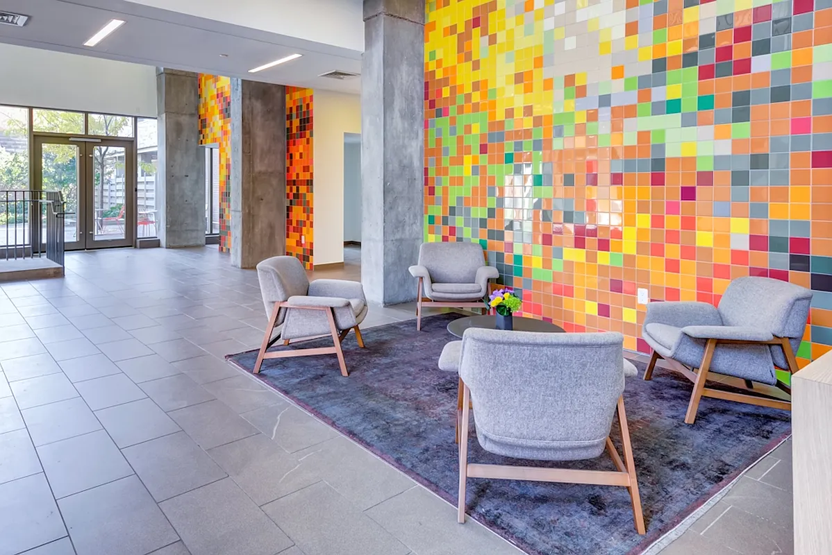 626 Flatbush Avenue, Unit 7E Brooklyn, NY 11225 - Photo 16 of 23 a living room with furniture and a floor to ceiling window