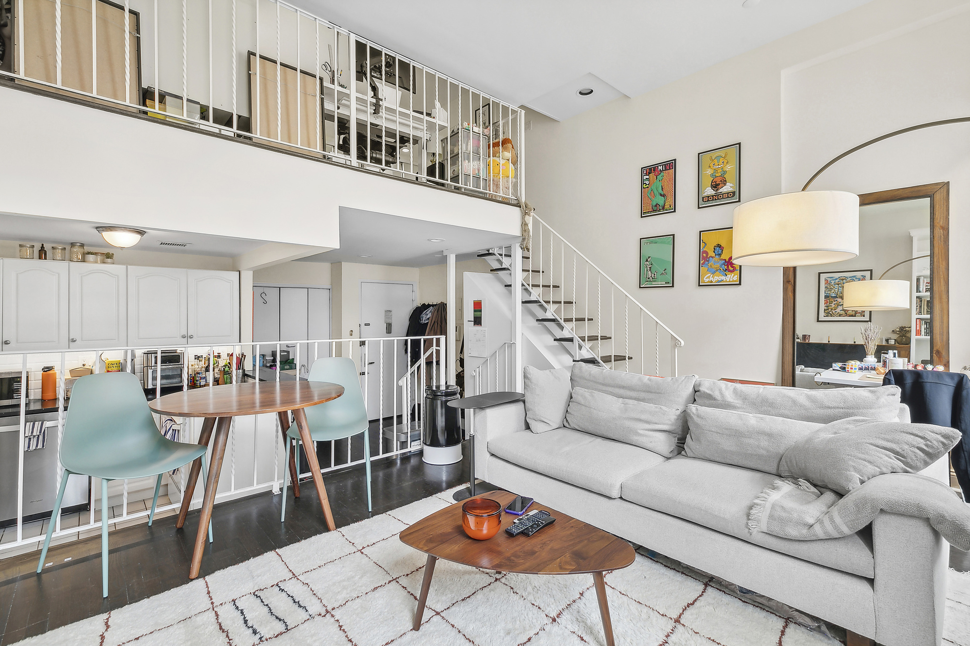 312 East 22nd Street, Unit 3A Manhattan, NY 10010 - Photo 1 of 7 a living room with furniture a rug and a chandelier