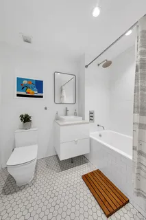 a bathroom with a toilet a sink and a bathtub