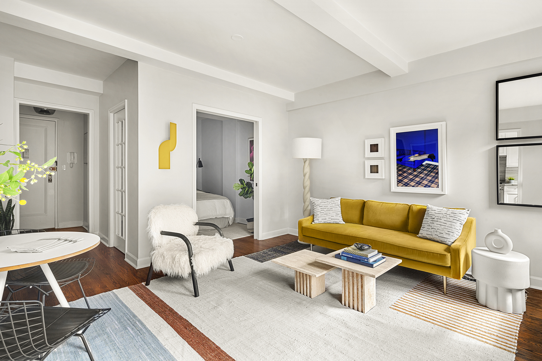 161 West 16th Street, Unit 6E Manhattan, NY 10011 - Photo 6 of 15 a living room with furniture and wooden floor