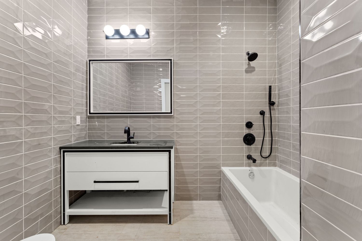 717 Manhattan Avenue, Unit 2A Brooklyn, NY 11222 - Photo 9 of 17 a bathroom with a sink a toilet and shower