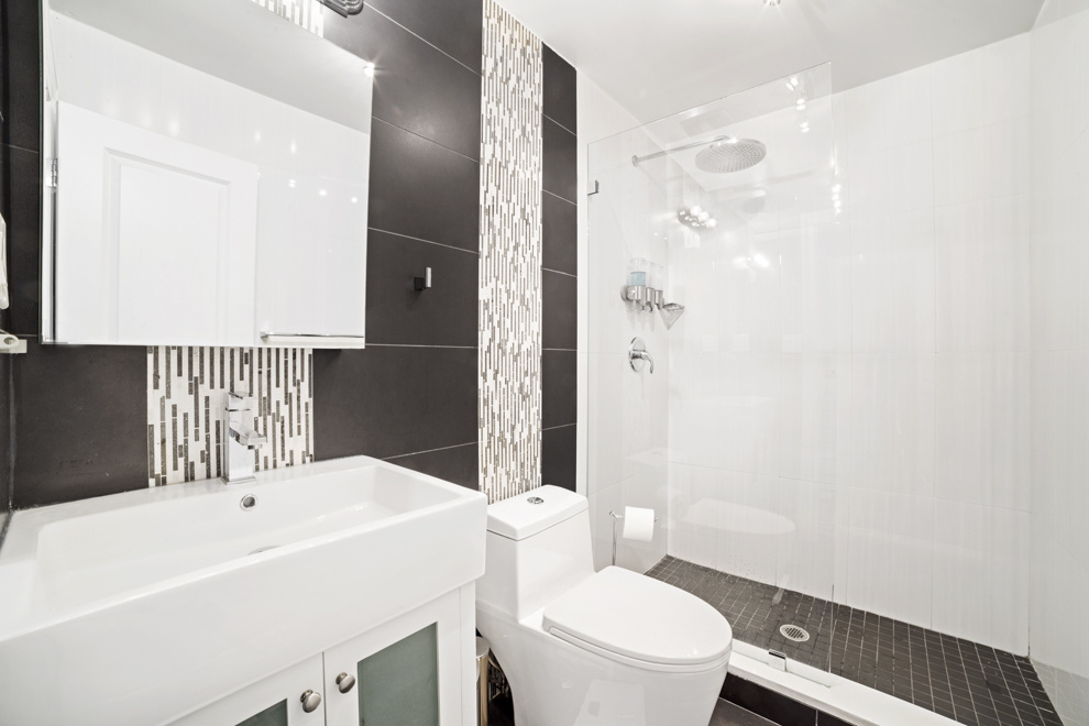 730 Quincy Street, Unit 2 Brooklyn, NY 11221 - Photo 6 of 11 a bathroom with a sink a toilet and shower