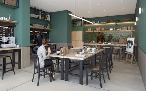 a dining room with a wooden table and chairs