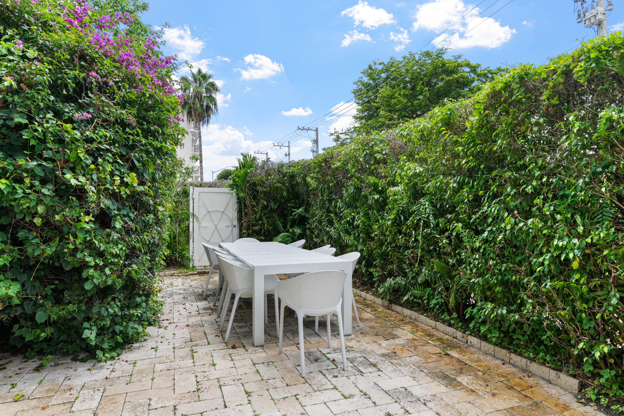 711 East 14th Street, Unit 7 Hialeah, FL 33010 - Photo 33 of 36 a table and chairs in a patio