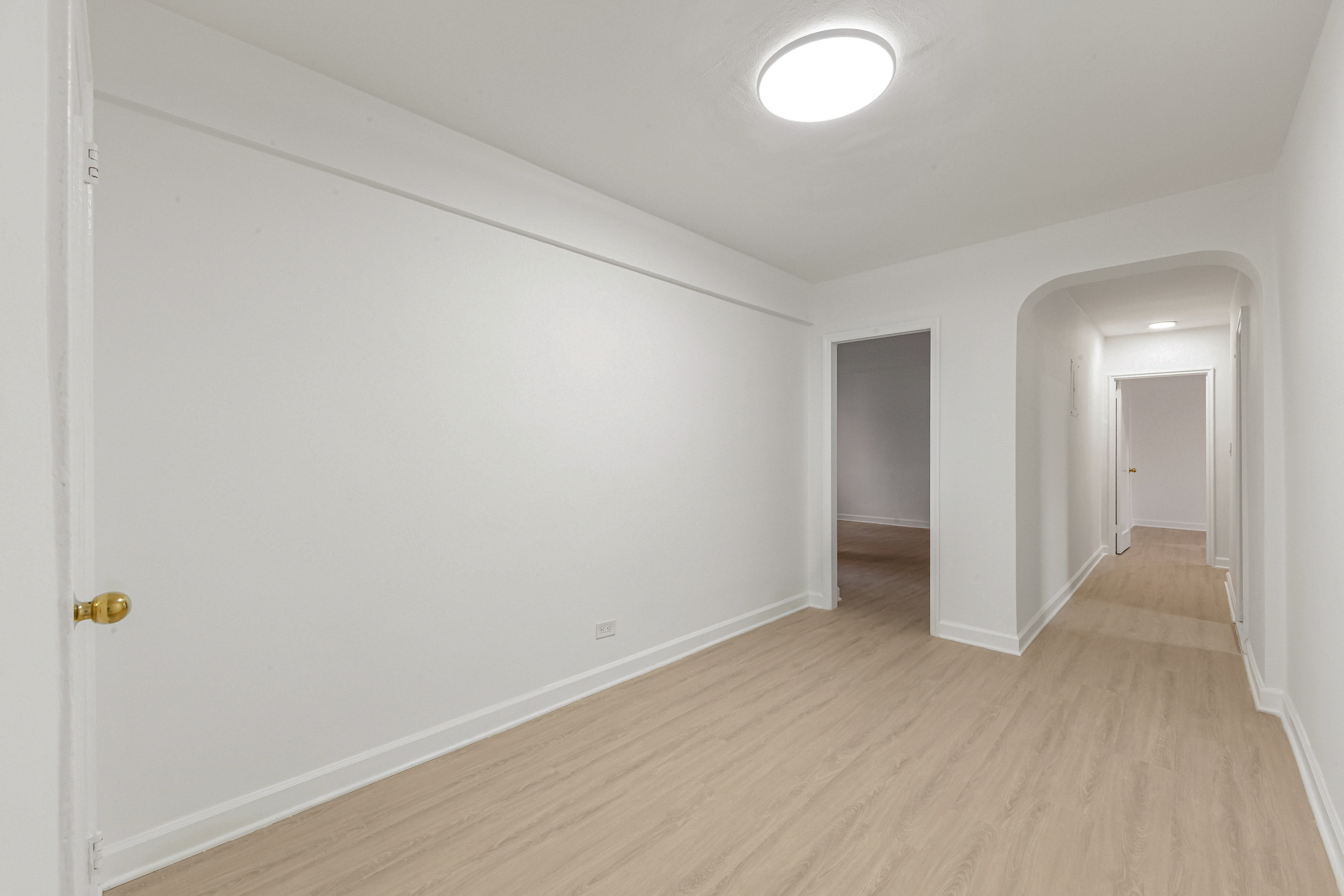 76-10 34th Avenue, Unit 2H Queens, NY 11372 - Photo 9 of 12 a view of an empty room