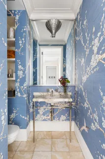 a bathroom with a sink a mirror and a shower