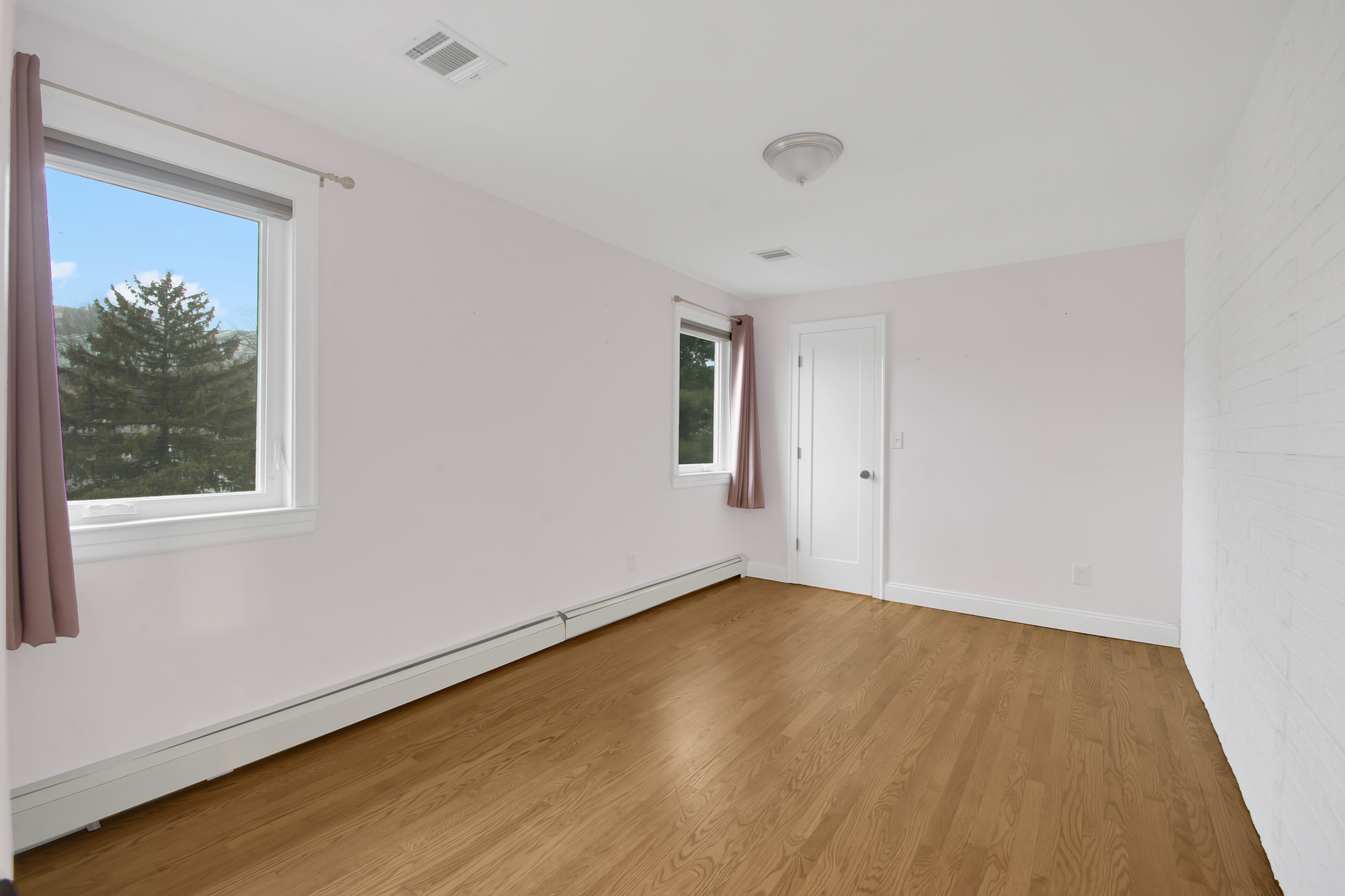 11 Nixon Avenue Staten Island, NY 10304 - Photo 17 of 29 a view of an empty room with wooden floor and a window
