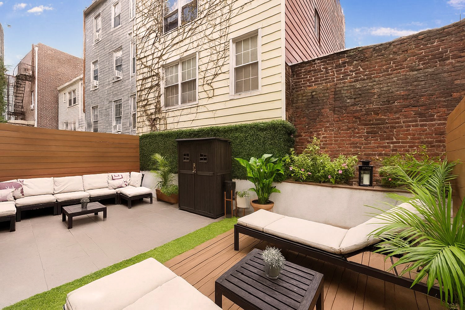 a balcony with furniture and a potted plant