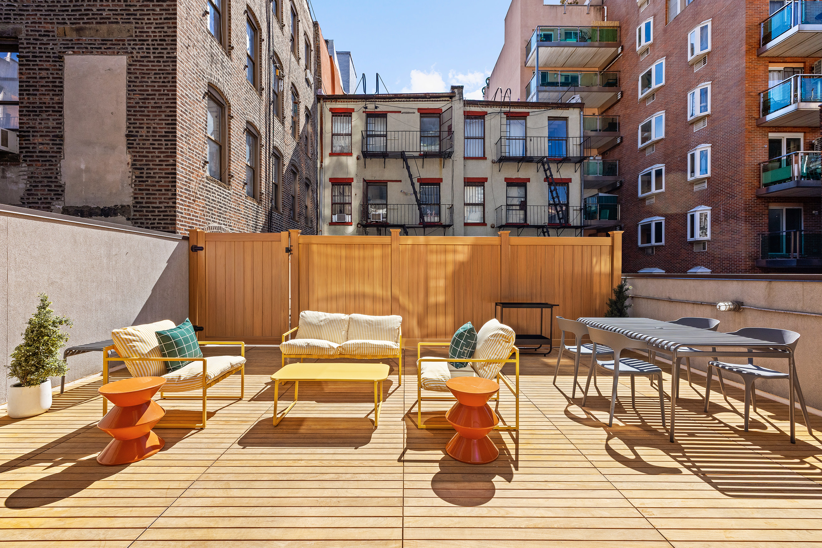 30 Orchard Street, Unit 2 Manhattan, NY 10002 - Photo 3 of 11 a roof deck view with glass windows and plants