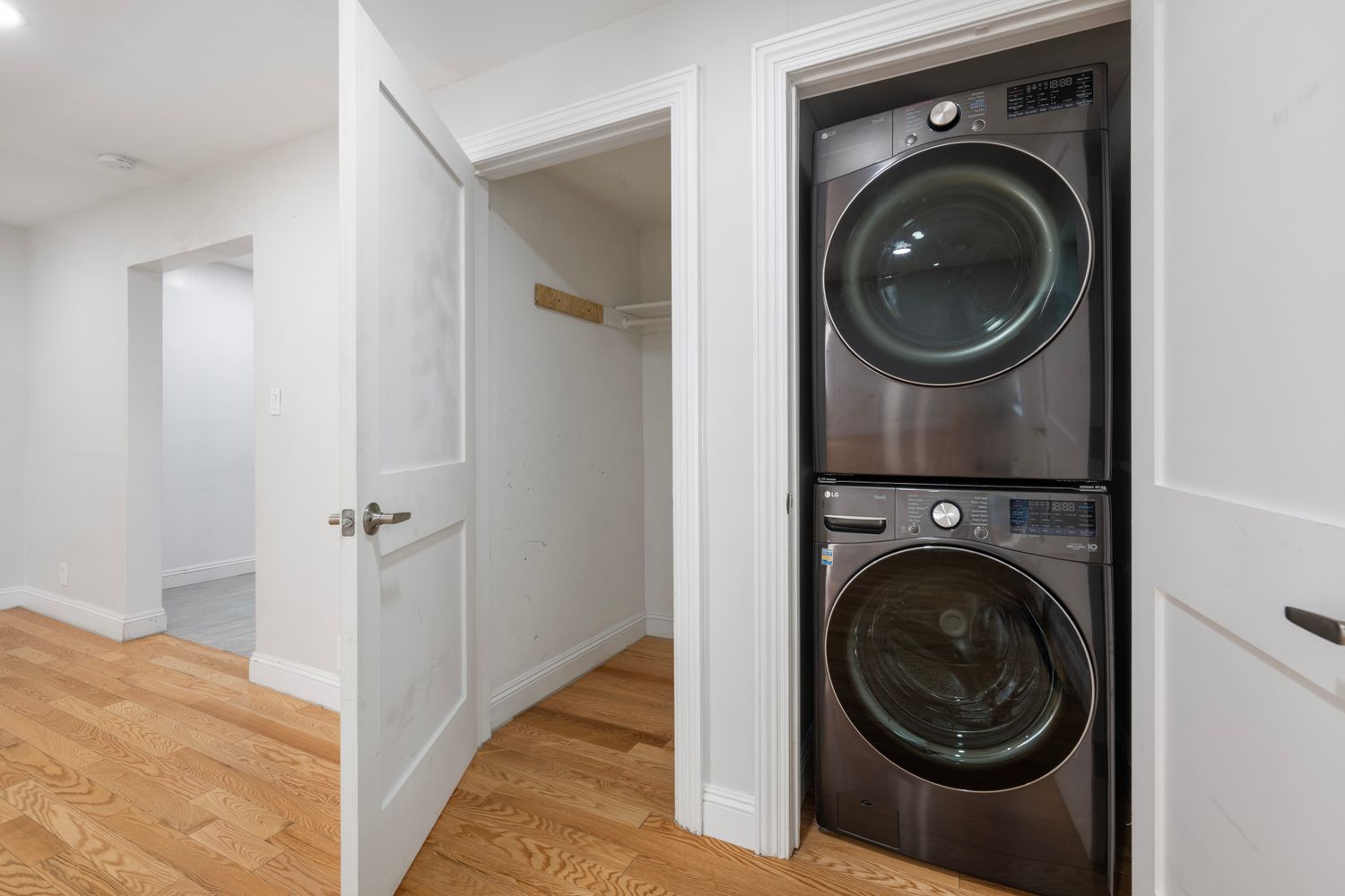 a view of a hallway with washer and dryer